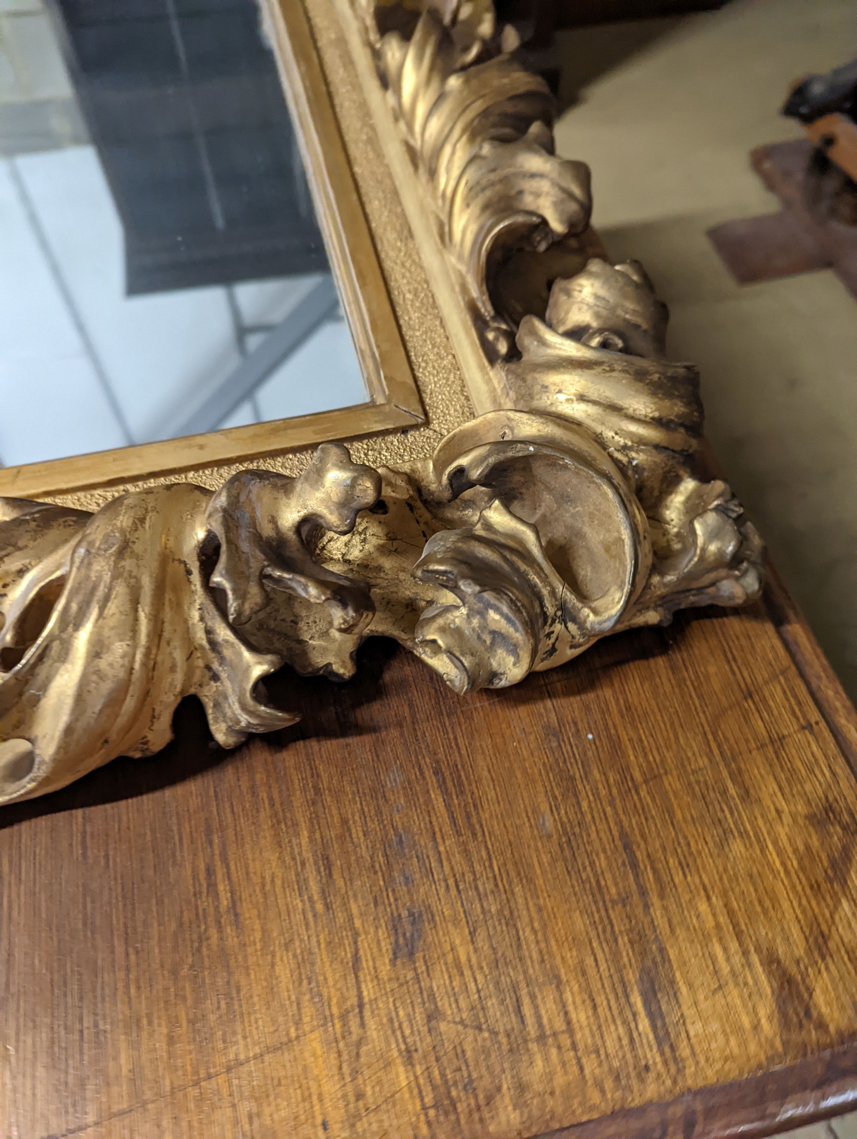 A large 19th century rectangular carved giltwood wall mirror with acanthus scroll frame, width 76cm, height 94cm